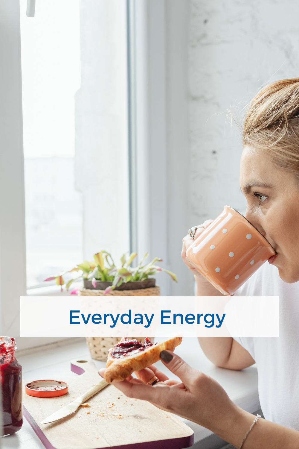 woman starting her day with tea and toast by the window