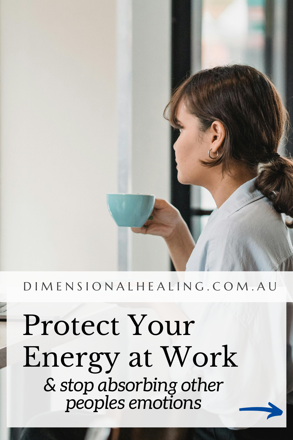 young woman sitting at her laptop drinking from a teacup worrying about the stressul energy in her workplace