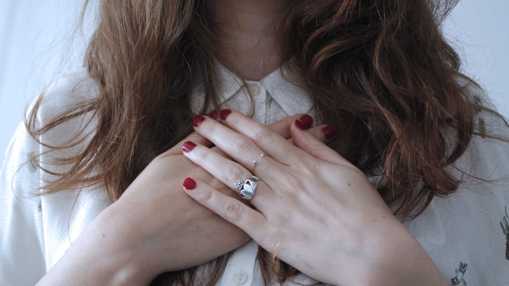 woman with her hands crossed on heart to express life purpose